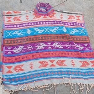 Colorful and soft Aztec fringed poncho